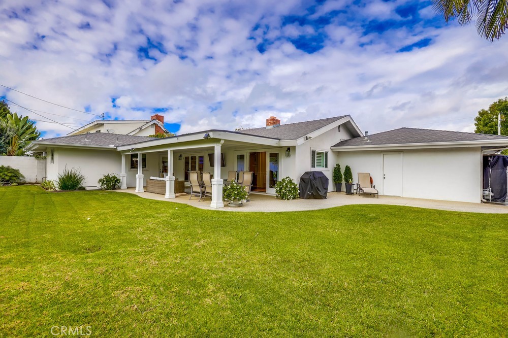 2879 Clubhouse Road Costa Mesa, CA 92626 - Photo 59 of 64 a front view of a house with swimming pool having outdoor seating