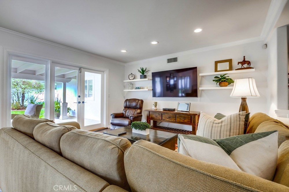 2879 Clubhouse Road Costa Mesa, CA 92626 - Photo 8 of 64 a living room with furniture and a flat screen tv