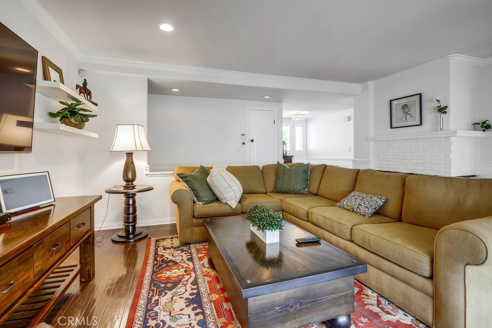 2879 Clubhouse Road Costa Mesa, CA 92626 - Photo 10 of 64 a living room with furniture and a wooden floor