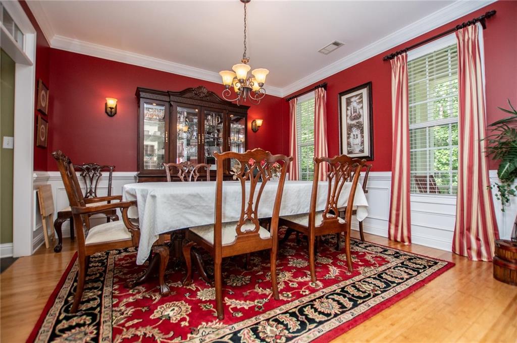 5522 Tyree Road Winston, GA 30187 - Photo 11 of 45 a view of a dining room with furniture window and wooden floor