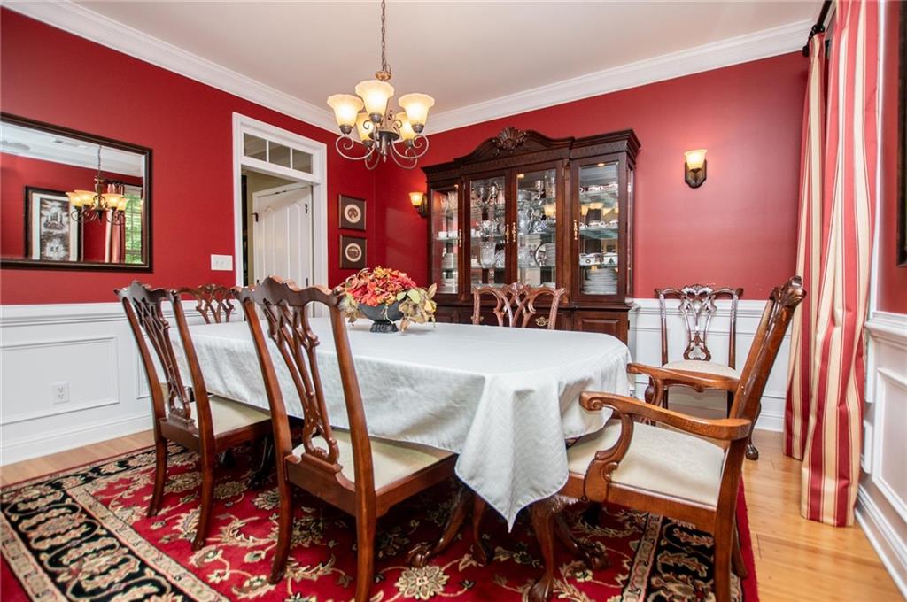 5522 Tyree Road Winston, GA 30187 - Photo 24 of 45 a view of a dining room with furniture and chandelier