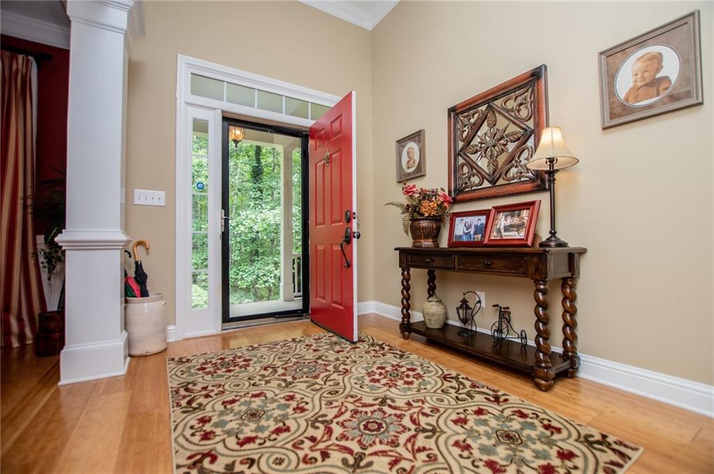5522 Tyree Road Winston, GA 30187 - Photo 26 of 45 a view of a hallway with wooden floor and a fireplace