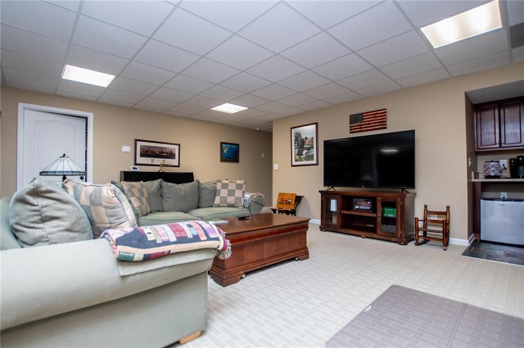 5522 Tyree Road Winston, GA 30187 - Photo 30 of 45 a living room with furniture and a flat screen tv