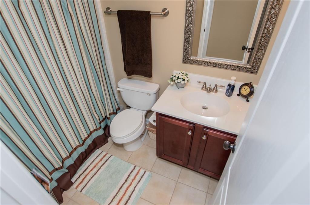 5522 Tyree Road Winston, GA 30187 - Photo 34 of 45 a bathroom with a sink toilet and mirror