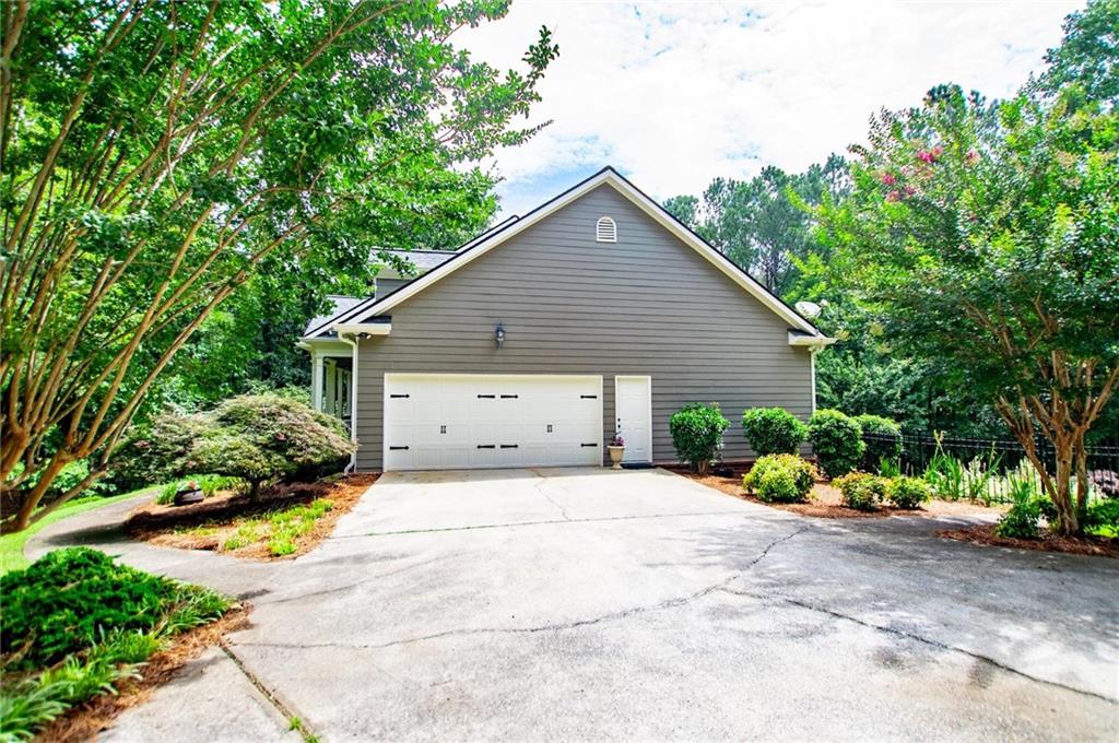 5522 Tyree Road Winston, GA 30187 - Photo 4 of 45 a view of a house with backyard and garden