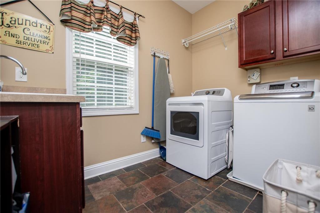 5522 Tyree Road Winston, GA 30187 - Photo 44 of 45 a utility room with dryer and washer