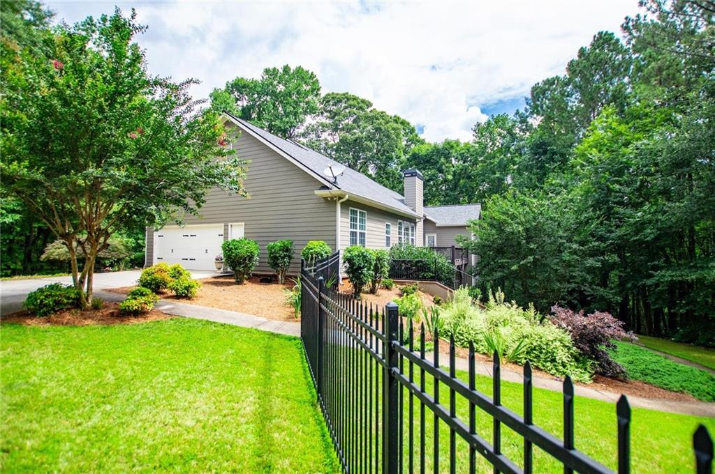 5522 Tyree Road Winston, GA 30187 - Photo 5 of 45 a view of a house with backyard and sitting area