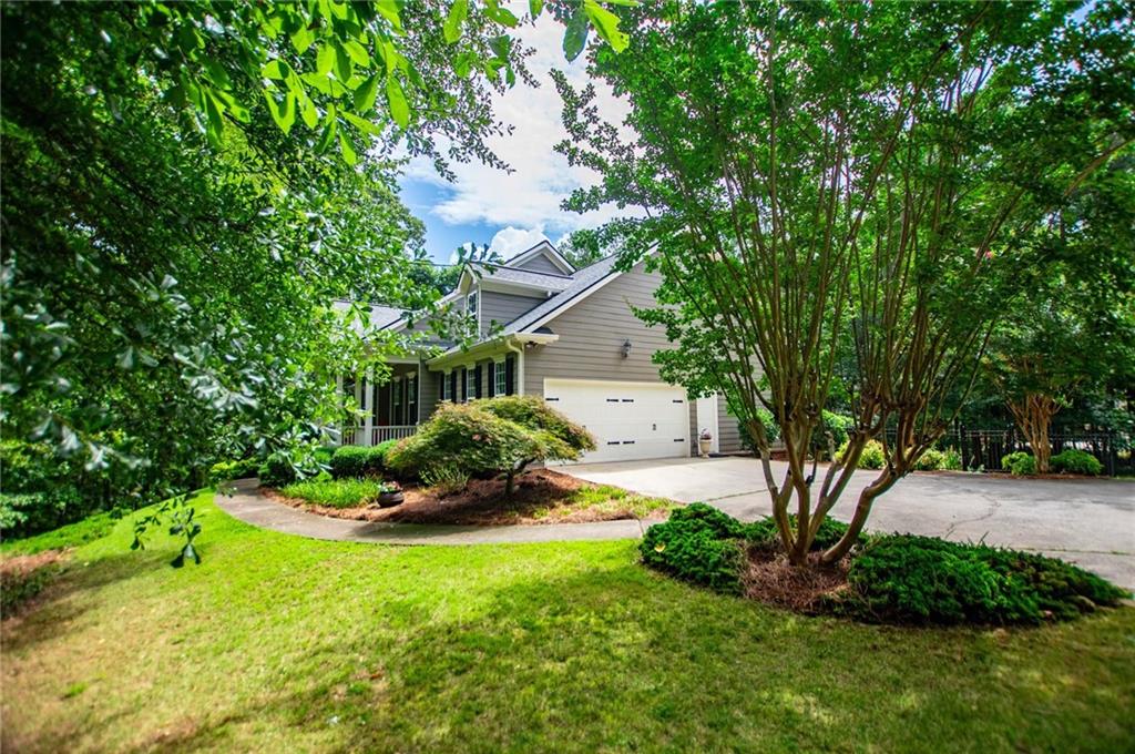 5522 Tyree Road Winston, GA 30187 - Photo 6 of 45 a front view of a house with a yard table and chairs