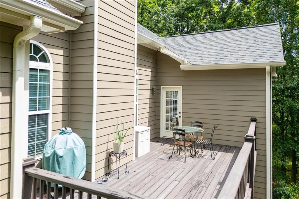 5522 Tyree Road Winston, GA 30187 - Photo 8 of 45 a view of a chair and tables in the balcony