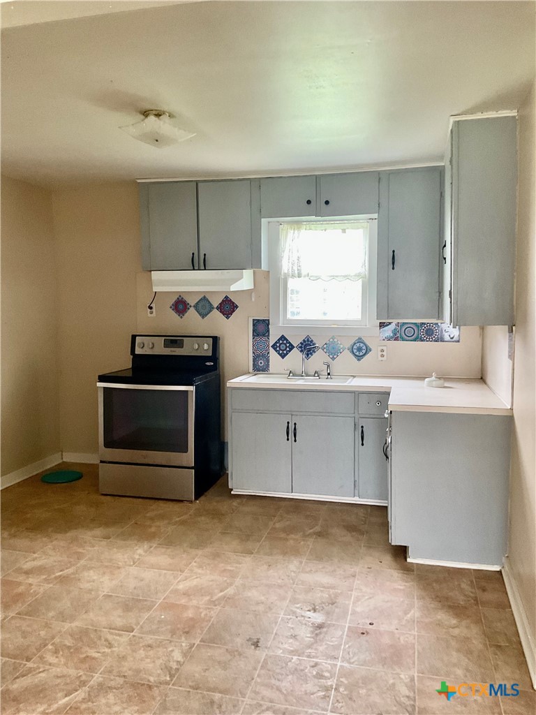 102 Clark Street Yoakum, TX 77995 - Photo 9 of 18 a room with a cabinets and a fireplace