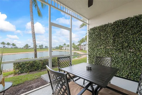 a view of an outdoor sitting area with furniture