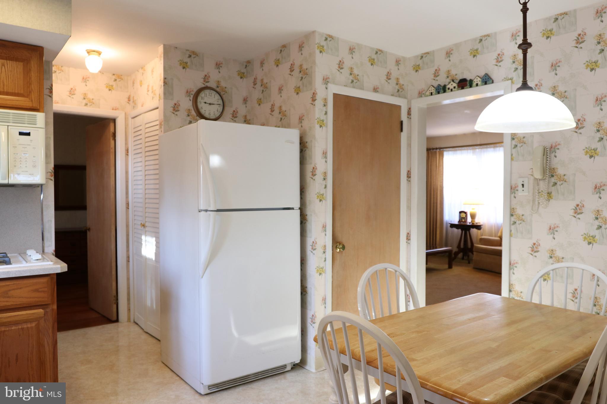 14 Olney Circle Haddonfield, NJ 08033 - Photo 11 of 21 a dining room with furniture and a chandelier