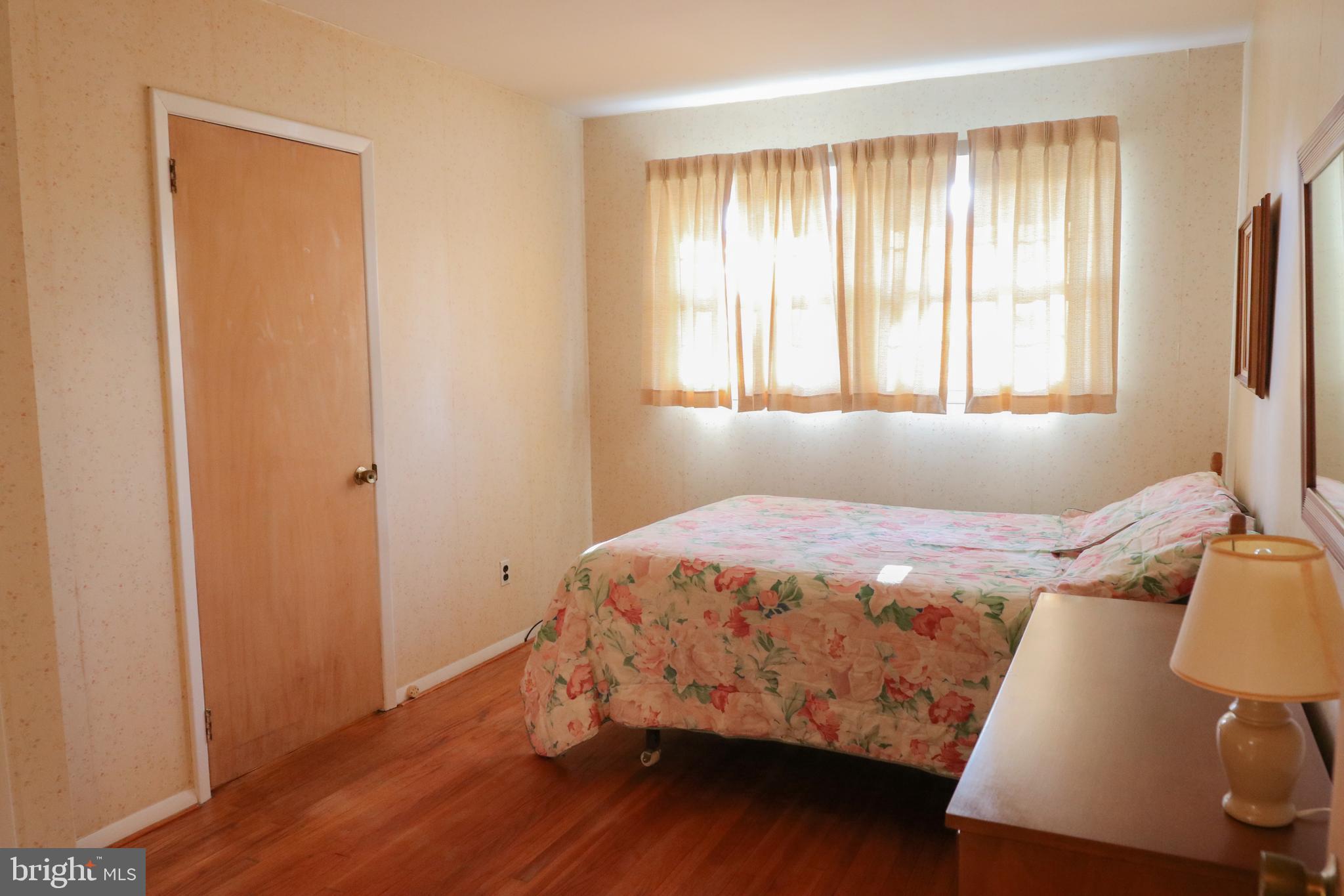 14 Olney Circle Haddonfield, NJ 08033 - Photo 13 of 21 a bed sitting in a bedroom next to a window