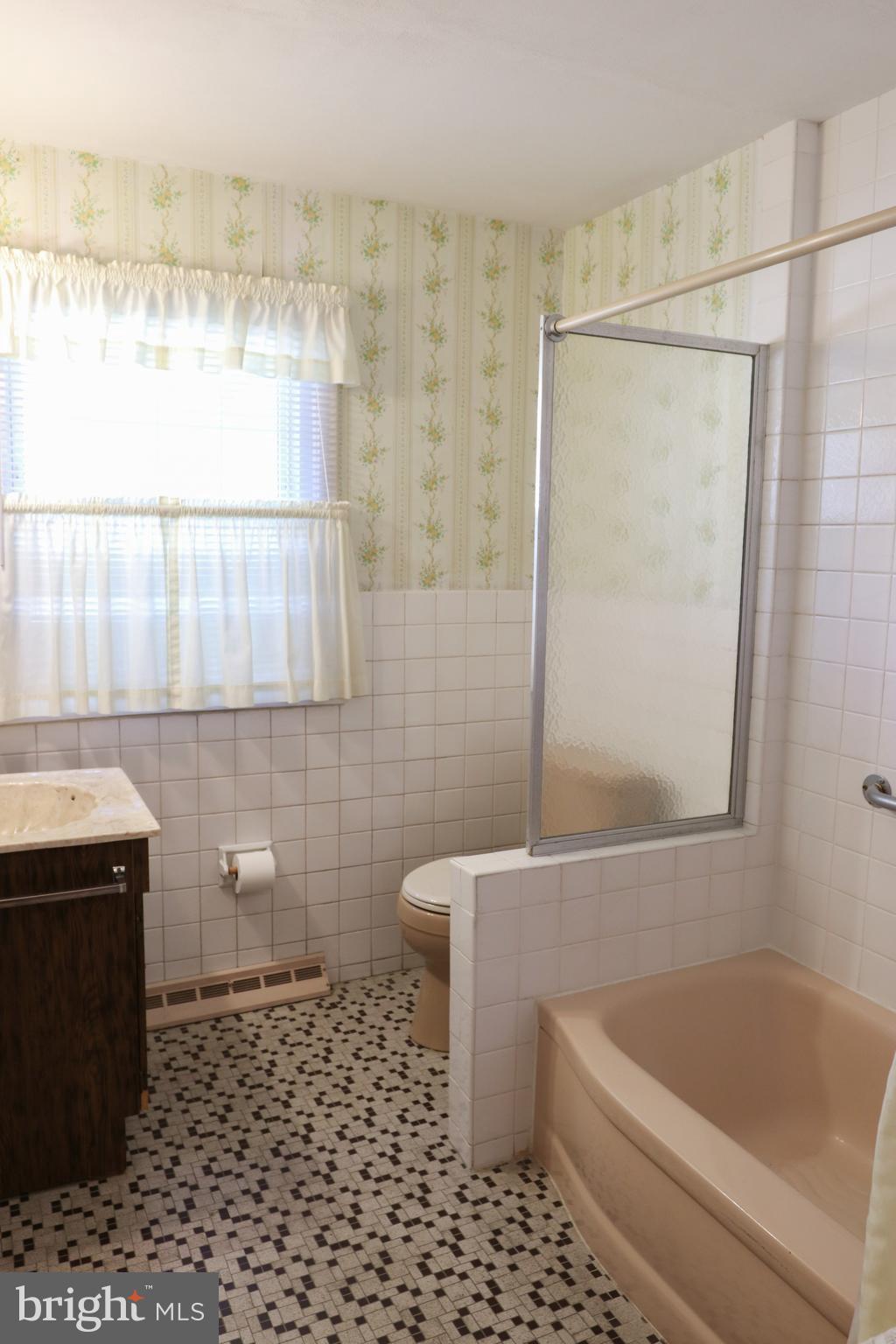 14 Olney Circle Haddonfield, NJ 08033 - Photo 15 of 21 a bathroom with a sink a toilet and shower