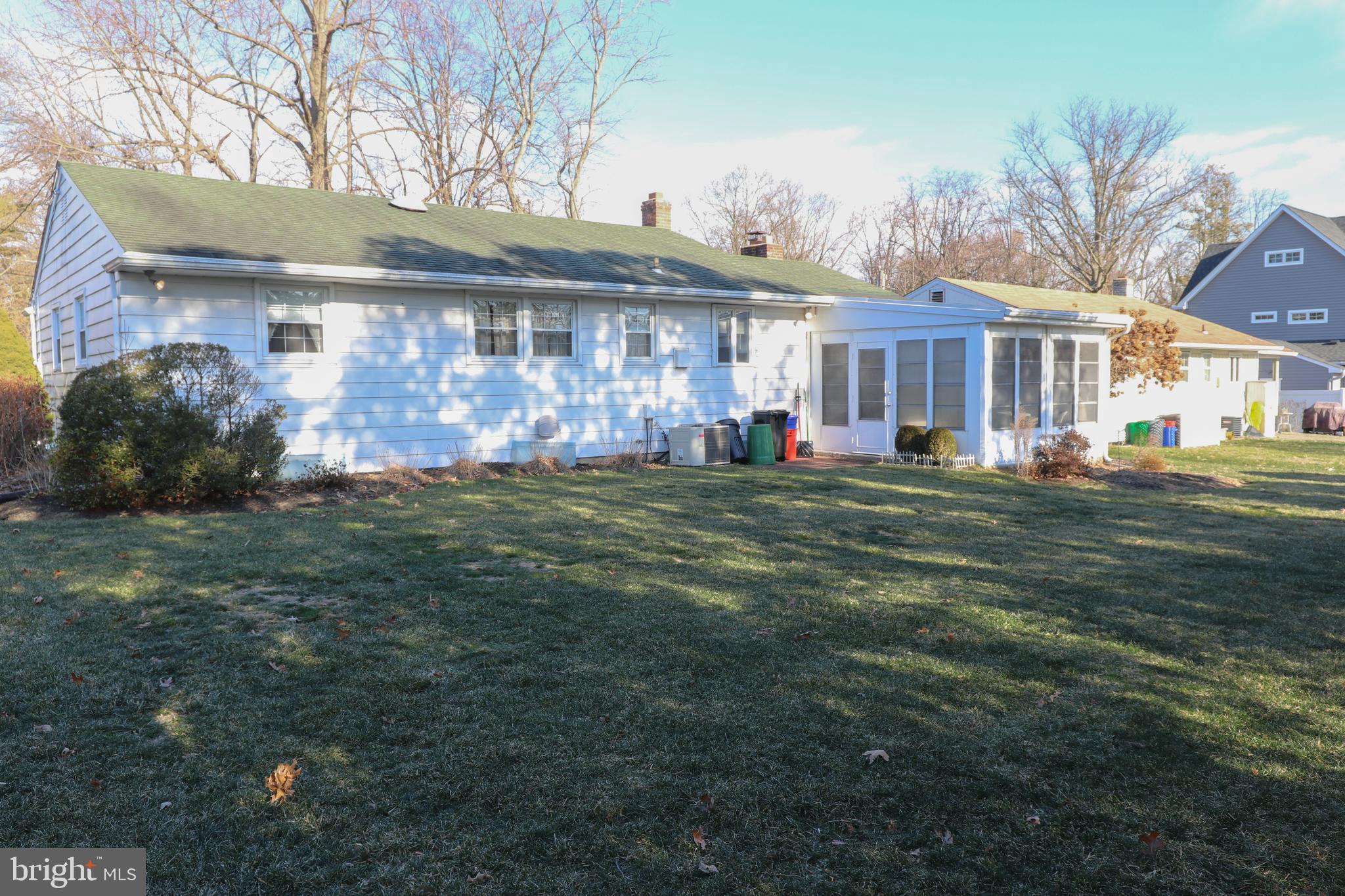 14 Olney Circle Haddonfield, NJ 08033 - Photo 20 of 21 a view of a big house with a big yard and potted plants