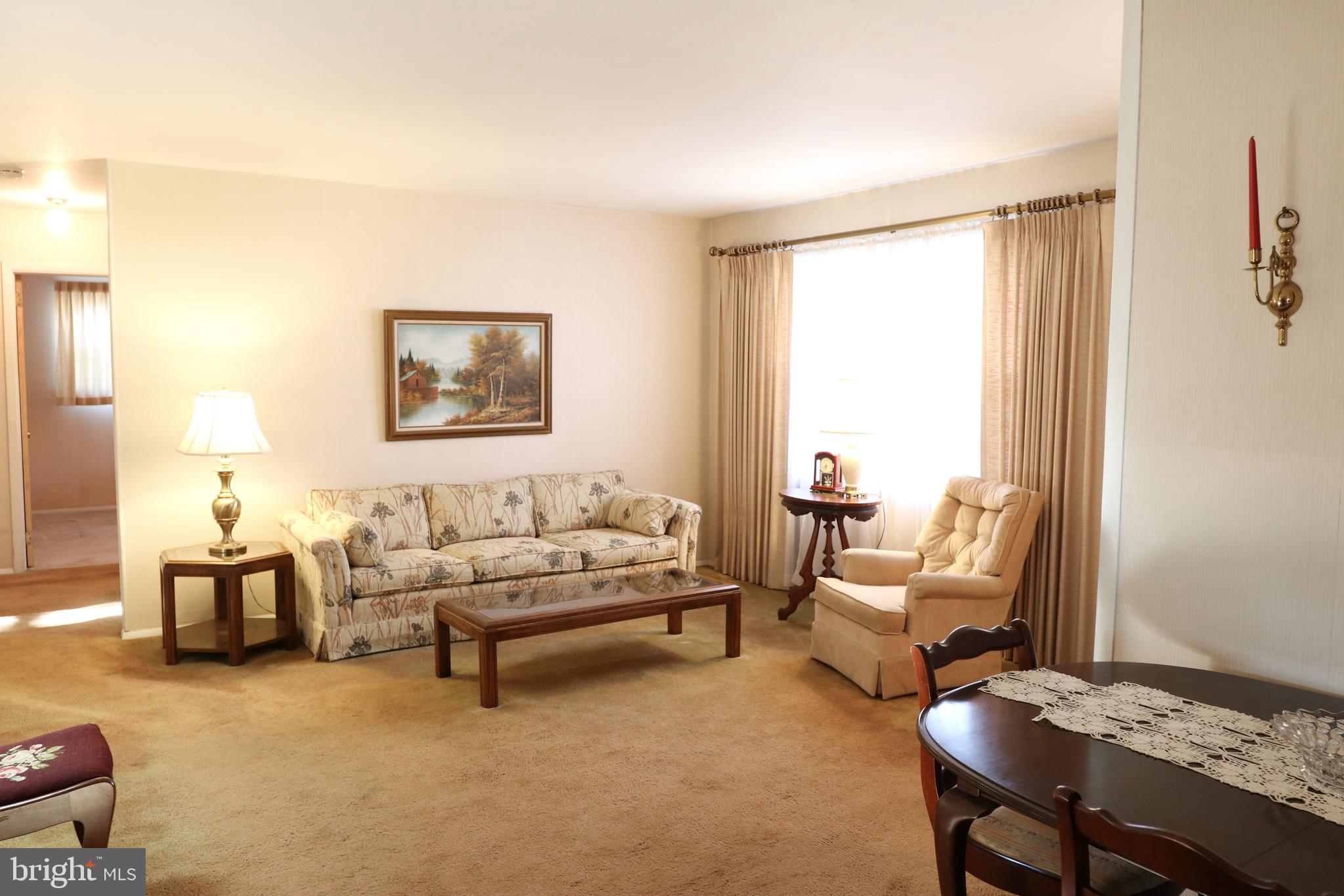 14 Olney Circle Haddonfield, NJ 08033 - Photo 3 of 21 a living room with furniture and a table