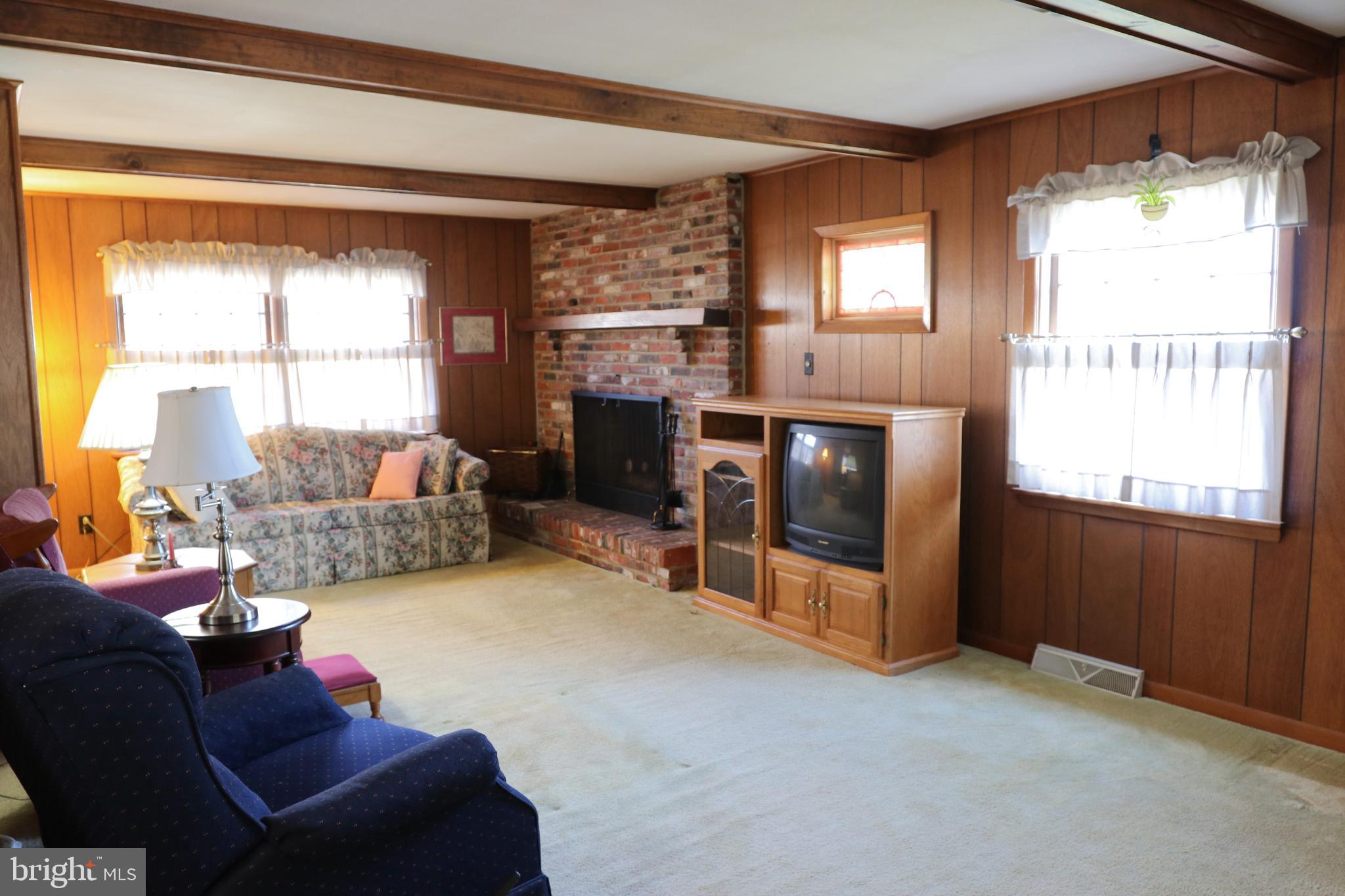 14 Olney Circle Haddonfield, NJ 08033 - Photo 6 of 21 a living room with furniture and a fireplace