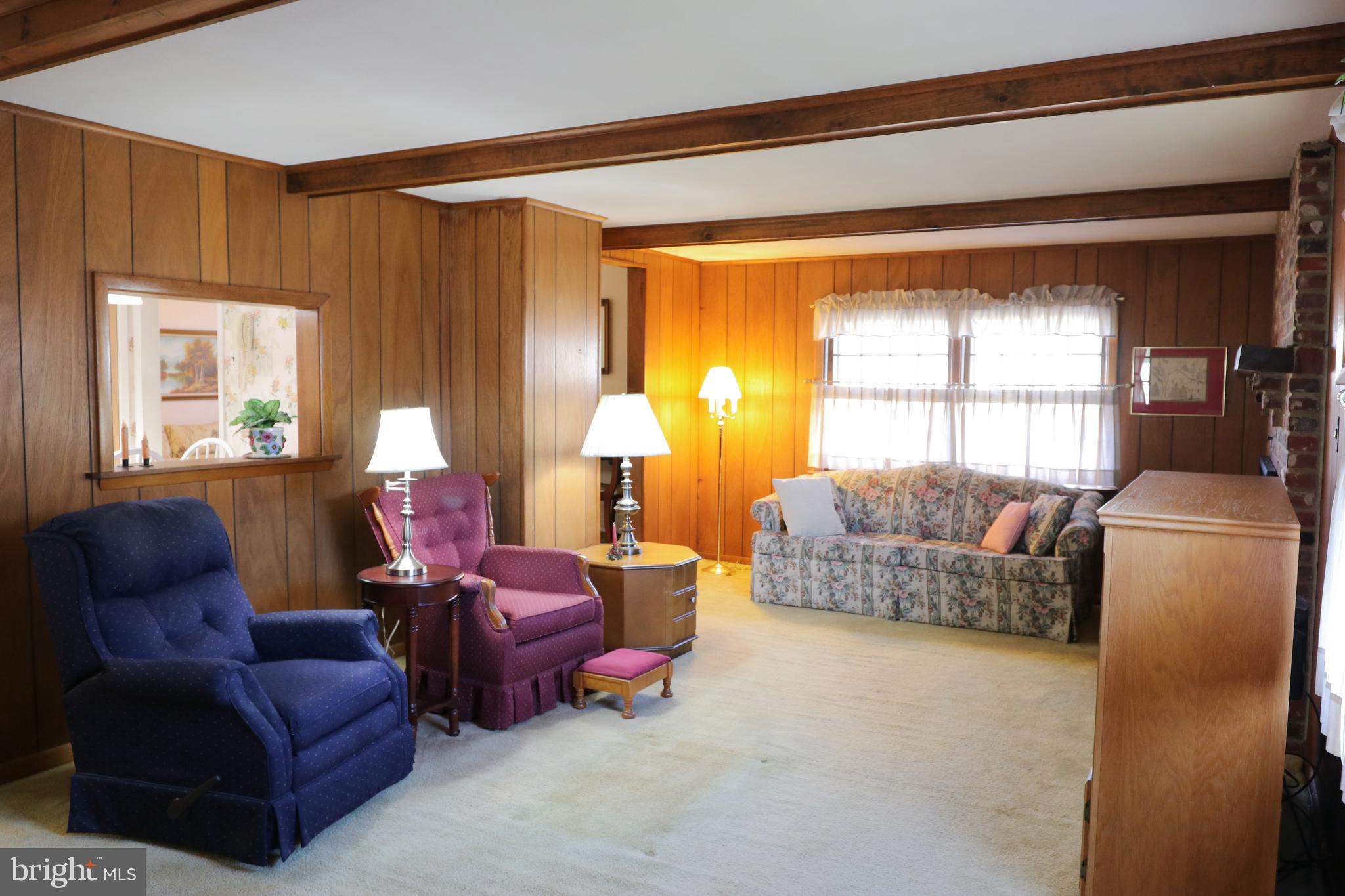 14 Olney Circle Haddonfield, NJ 08033 - Photo 8 of 21 a living room with furniture and a large window
