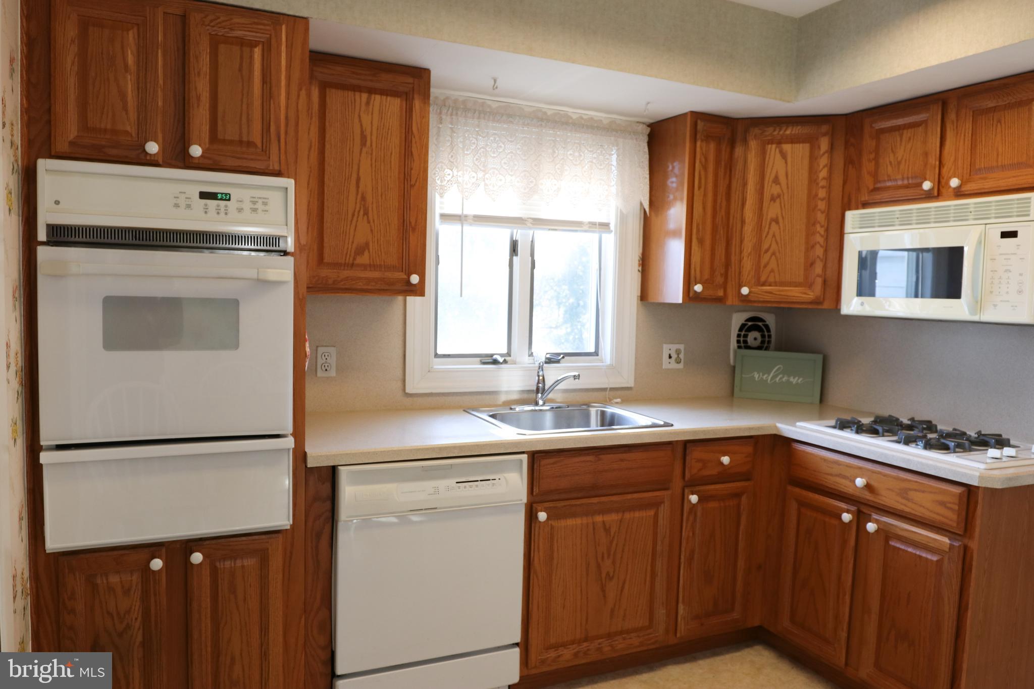 14 Olney Circle Haddonfield, NJ 08033 - Photo 10 of 21 a kitchen with a sink stove and cabinets