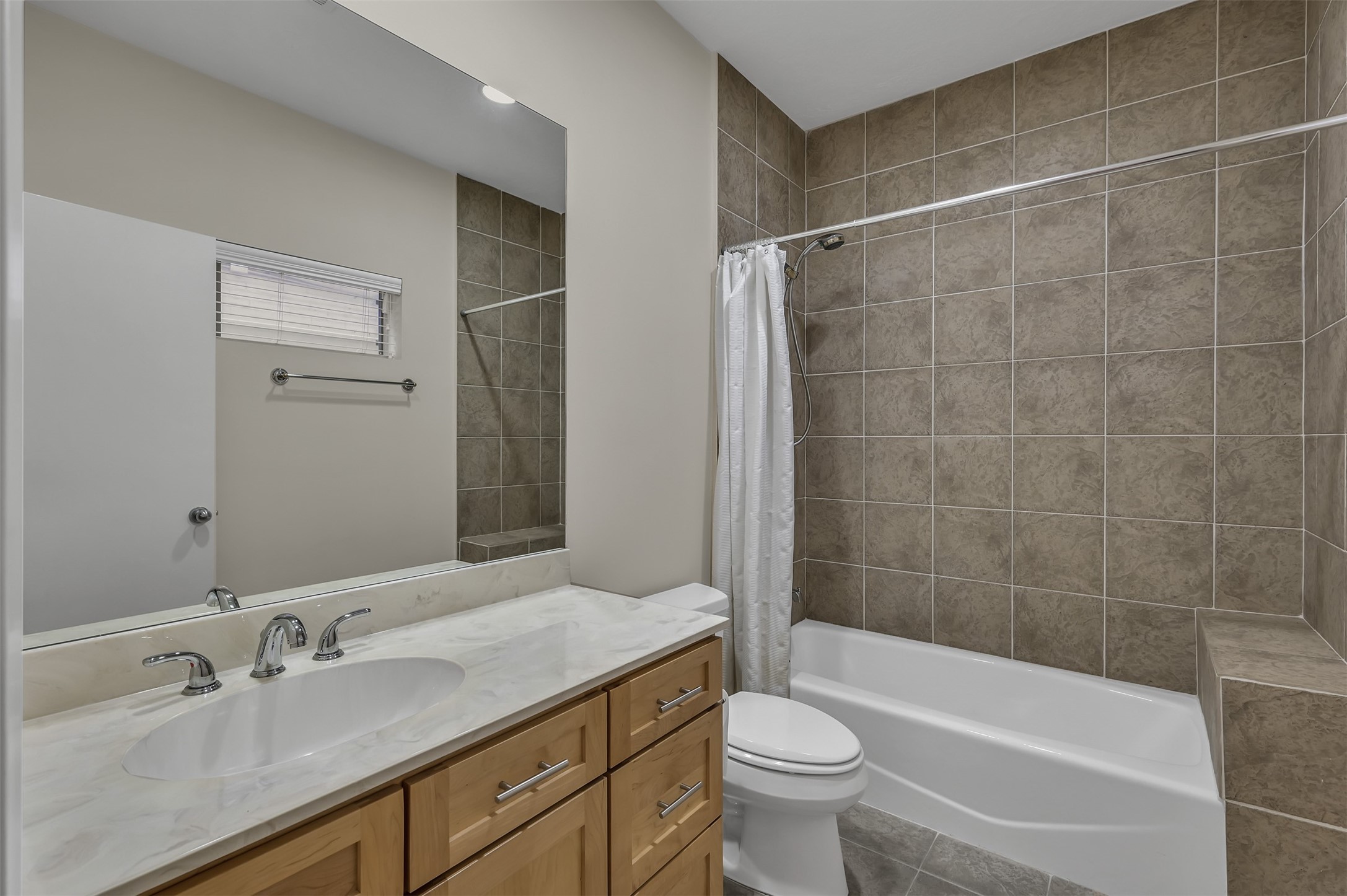 1503 California Street, Unit B Houston, TX 77006 - Photo 19 of 23 a bathroom with a bathtub shower sink mirror vanity and toilet