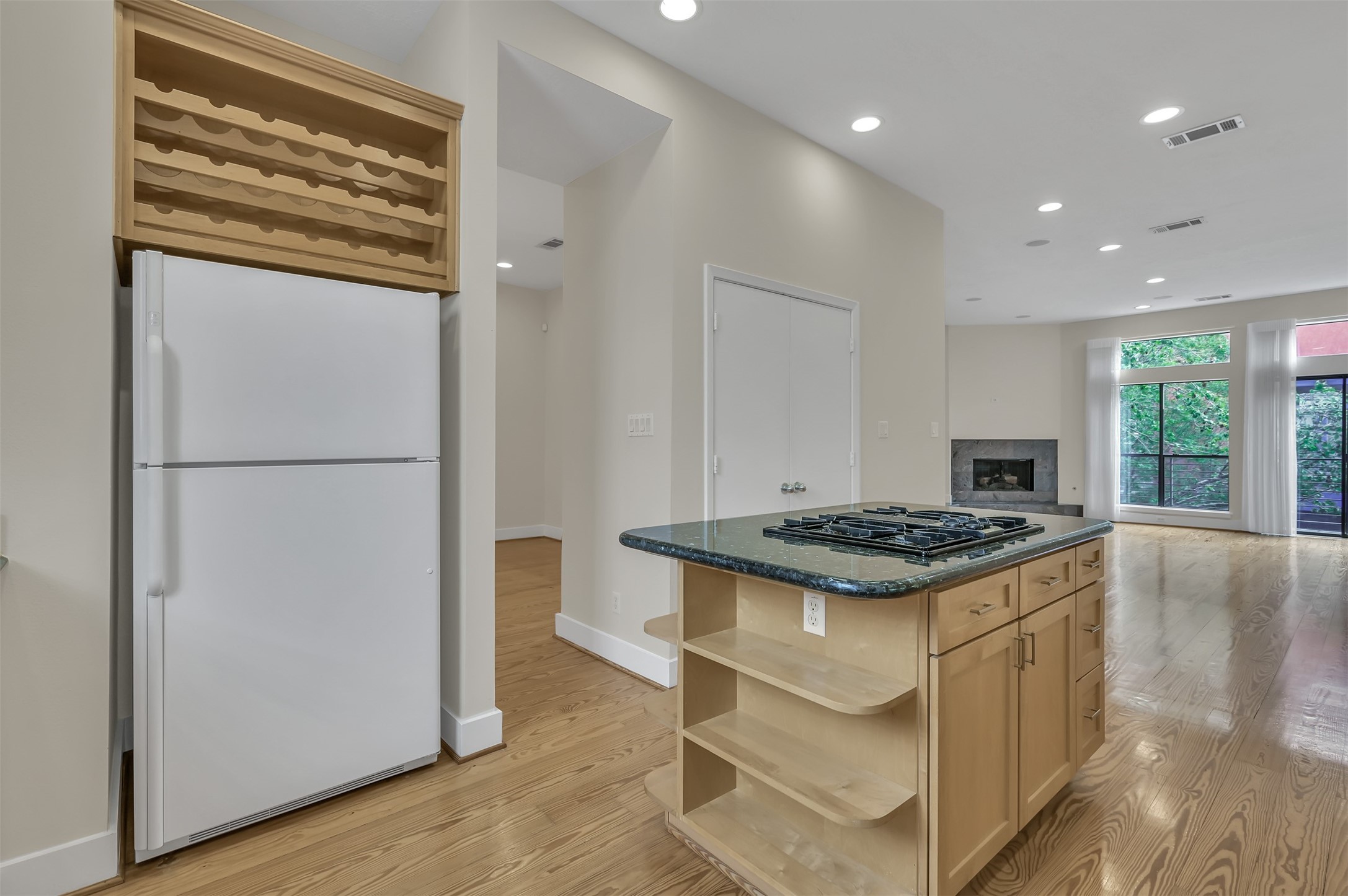 1503 California Street, Unit B Houston, TX 77006 - Photo 8 of 23 a kitchen with granite countertop a stove and a refrigerator