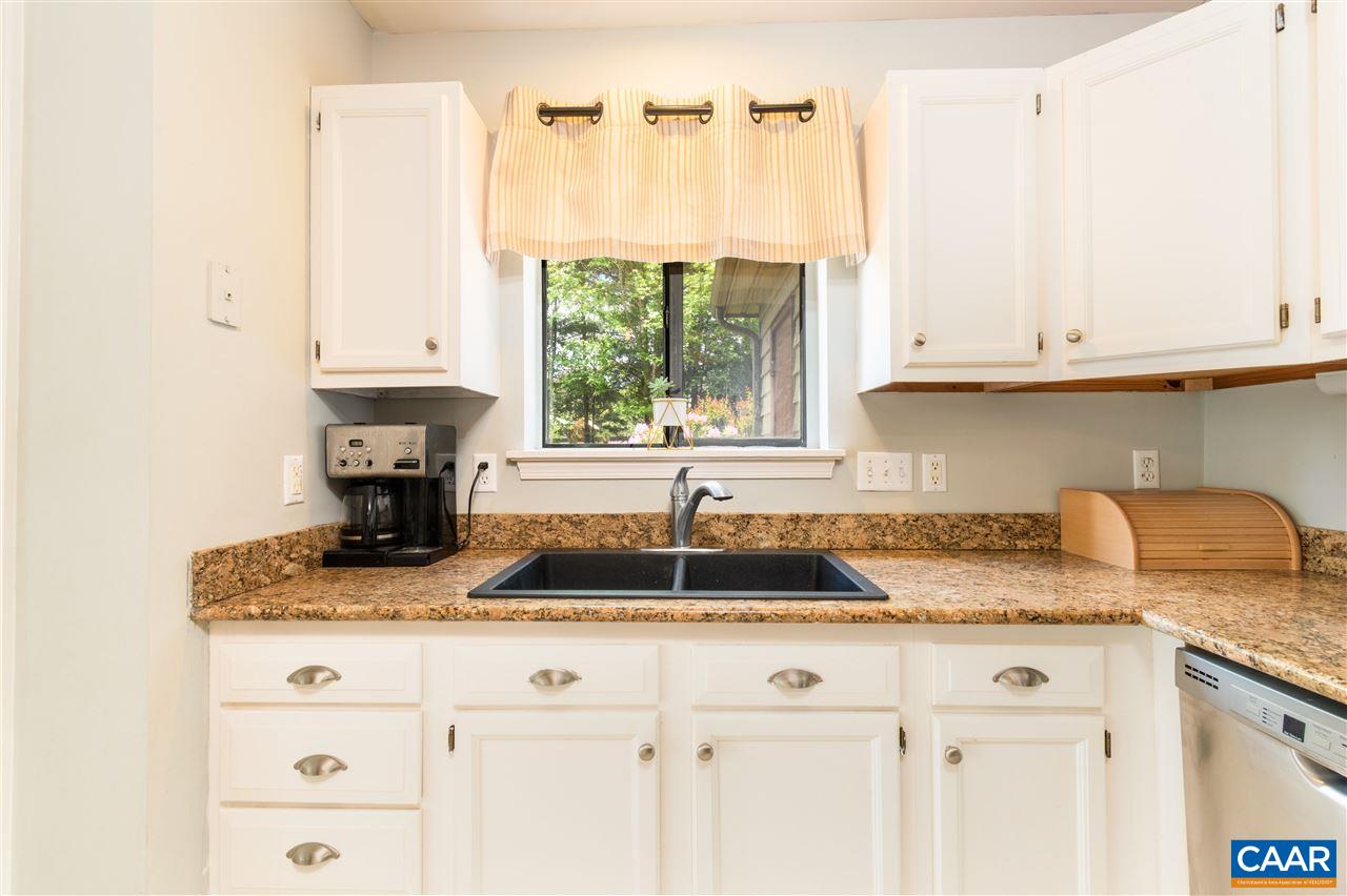1124 Amber Ridge Road Charlottesville, VA 22901 - Photo 10 of 30 a kitchen with granite countertop a sink a window and cabinets
