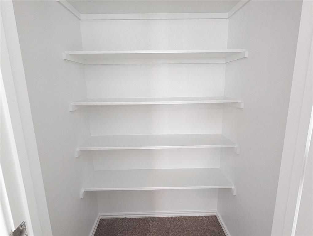 152 Avre Loop Kyle, TX 78640 - Photo 15 of 24 Efficiently organized storage space featuring crisp white shelving.
