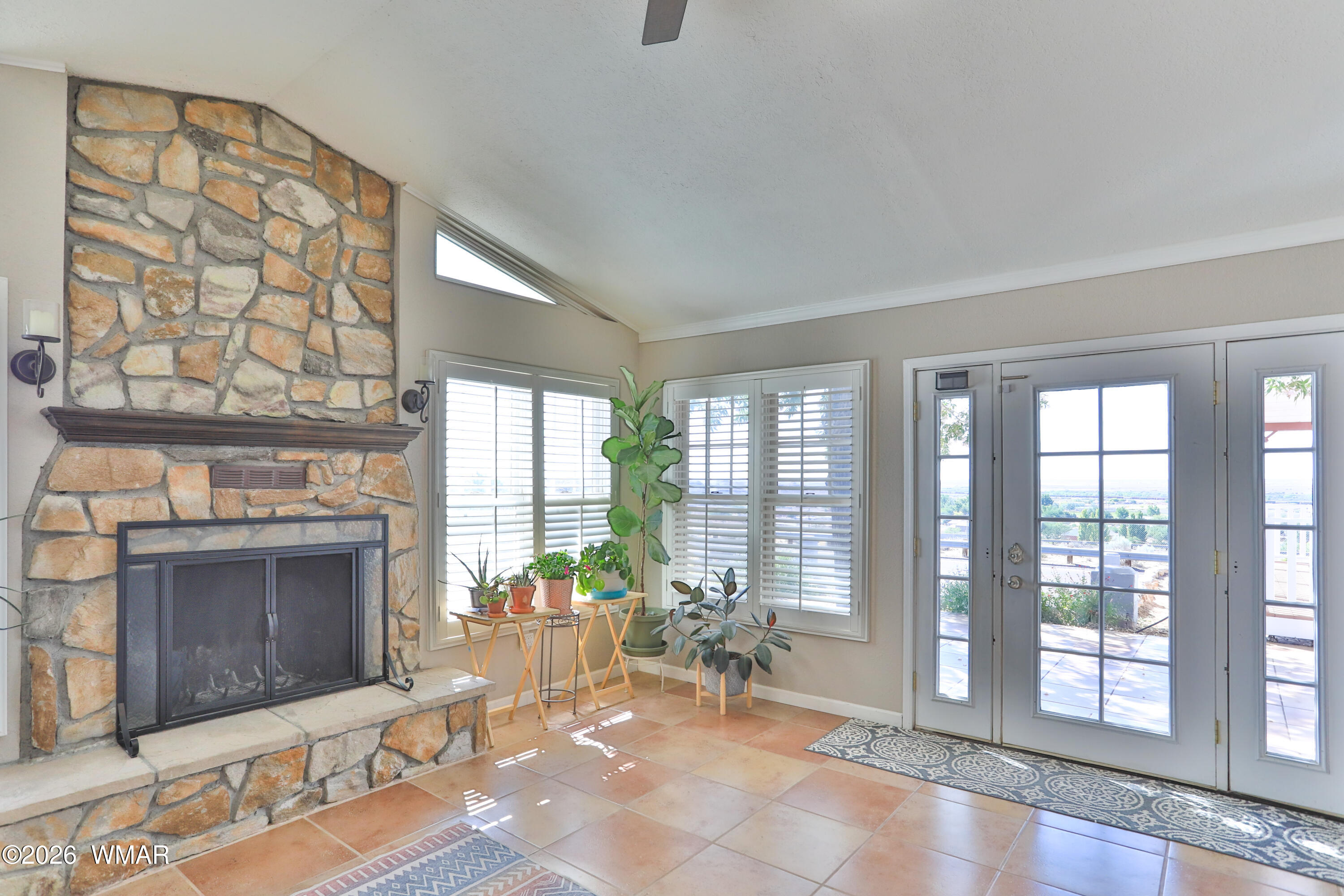 102 Crestview Road Holbrook, AZ 86025 - Photo 7 of 55 a living room with furniture a window and a fireplace