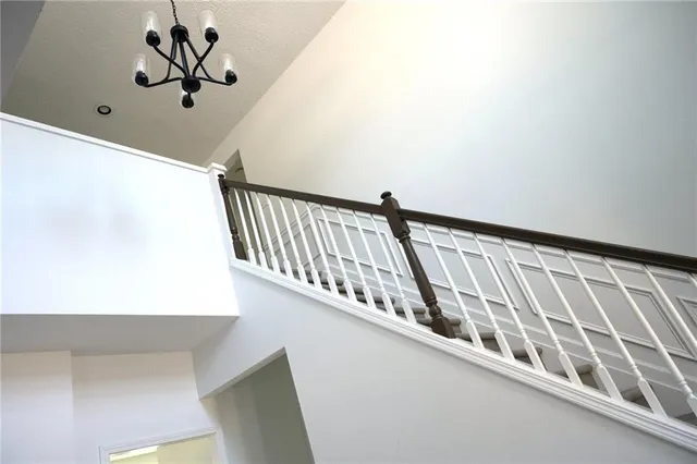 a bathroom with a granite countertop sink mirror vanity and toilet