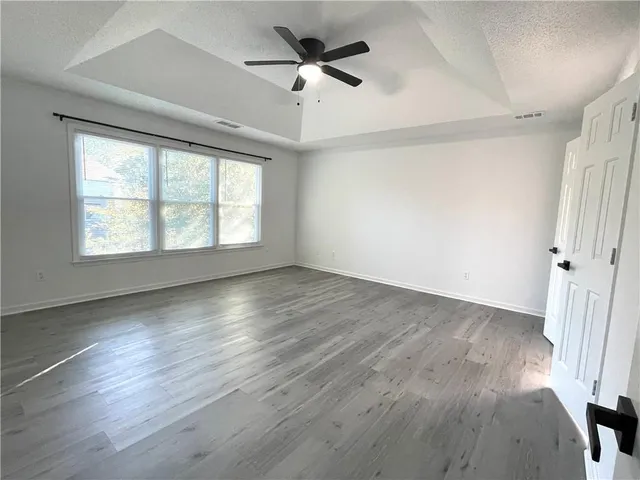 a bathroom with a sink a large mirror and a bathtub