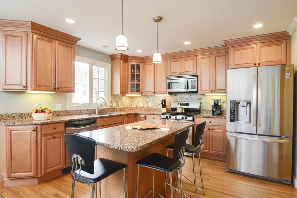 15 Cerina Road, Unit 15 Boston, MA 02130 - Photo 1 of 28 a kitchen with granite countertop a center island stainless steel appliances cabinets and a counter top space