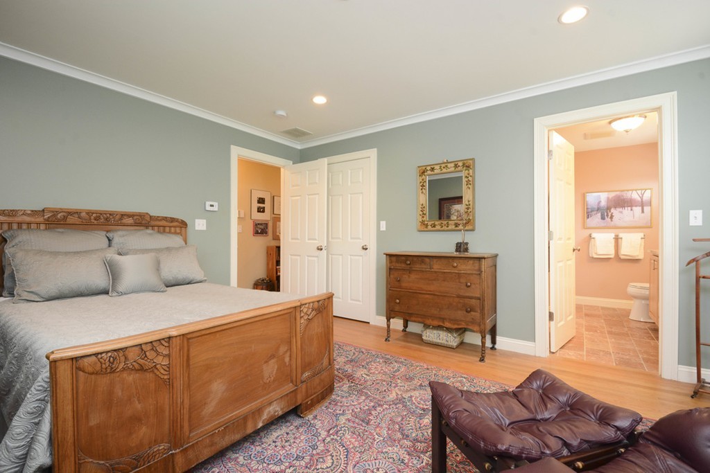 15 Cerina Road, Unit 15 Boston, MA 02130 - Photo 12 of 28 a bedroom with a bed and wooden floor