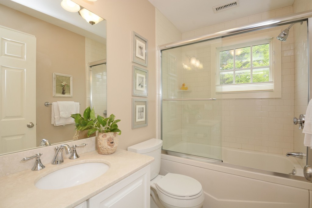 15 Cerina Road, Unit 15 Boston, MA 02130 - Photo 15 of 28 a bathroom with a granite countertop sink toilet and shower