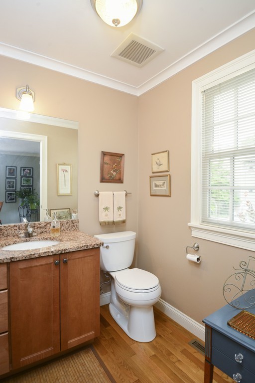 15 Cerina Road, Unit 15 Boston, MA 02130 - Photo 16 of 28 a bathroom with a granite countertop toilet sink and mirror