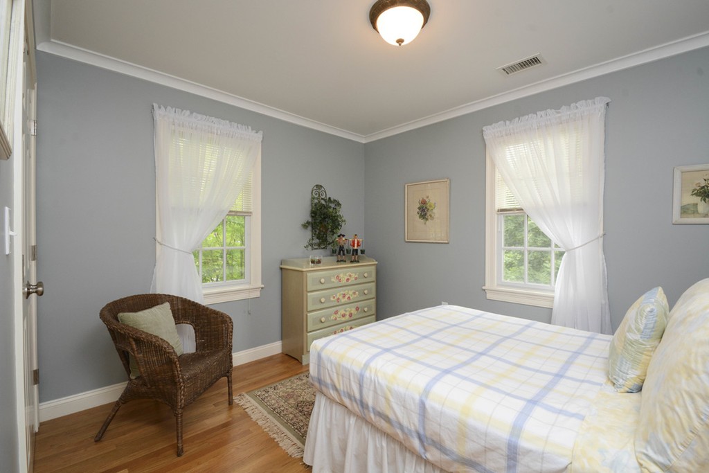 15 Cerina Road, Unit 15 Boston, MA 02130 - Photo 17 of 28 a bedroom with a bed and a chair with window