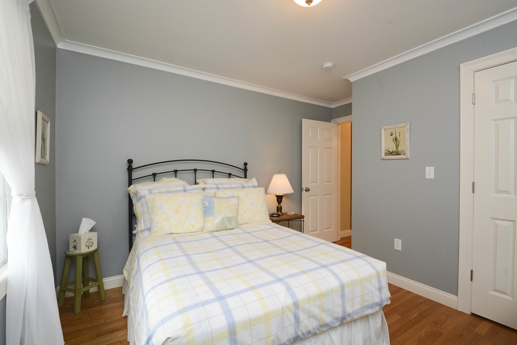 15 Cerina Road, Unit 15 Boston, MA 02130 - Photo 18 of 28 a bedroom with a bed and a night stand