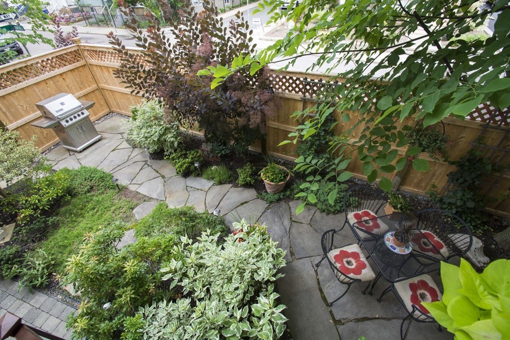 15 Cerina Road, Unit 15 Boston, MA 02130 - Photo 21 of 28 an outdoor space with lots of plants and trees