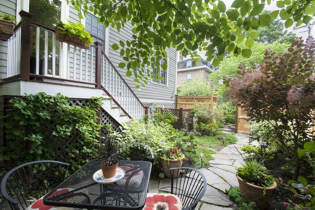15 Cerina Road, Unit 15 Boston, MA 02130 - Photo 22 of 28 a view of a chair and table in backyard of the house