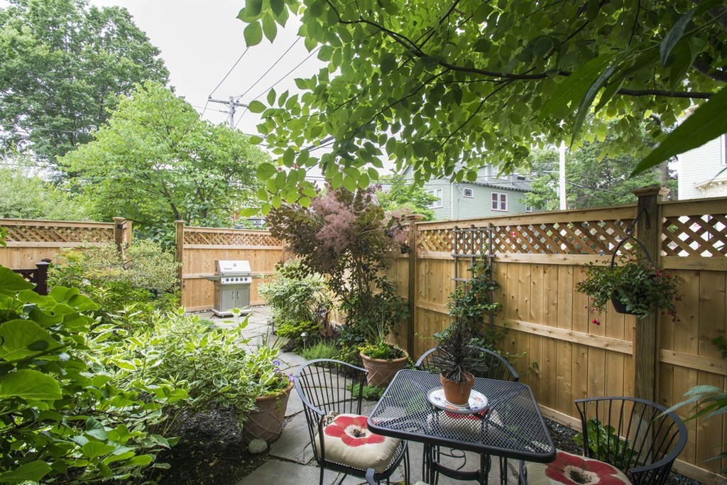 15 Cerina Road, Unit 15 Boston, MA 02130 - Photo 23 of 28 a view of a patio with table and chairs and potted plants