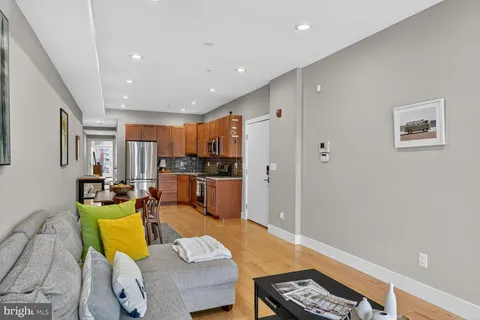 a living room with furniture and a table