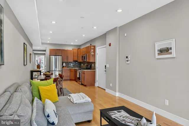 a living room with furniture and a table