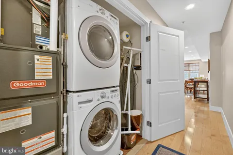 a view of a hallway with washer and dryer