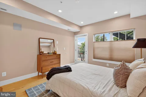 a bedroom with a bed and a mirror