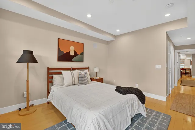 a bedroom with a bed and night stand