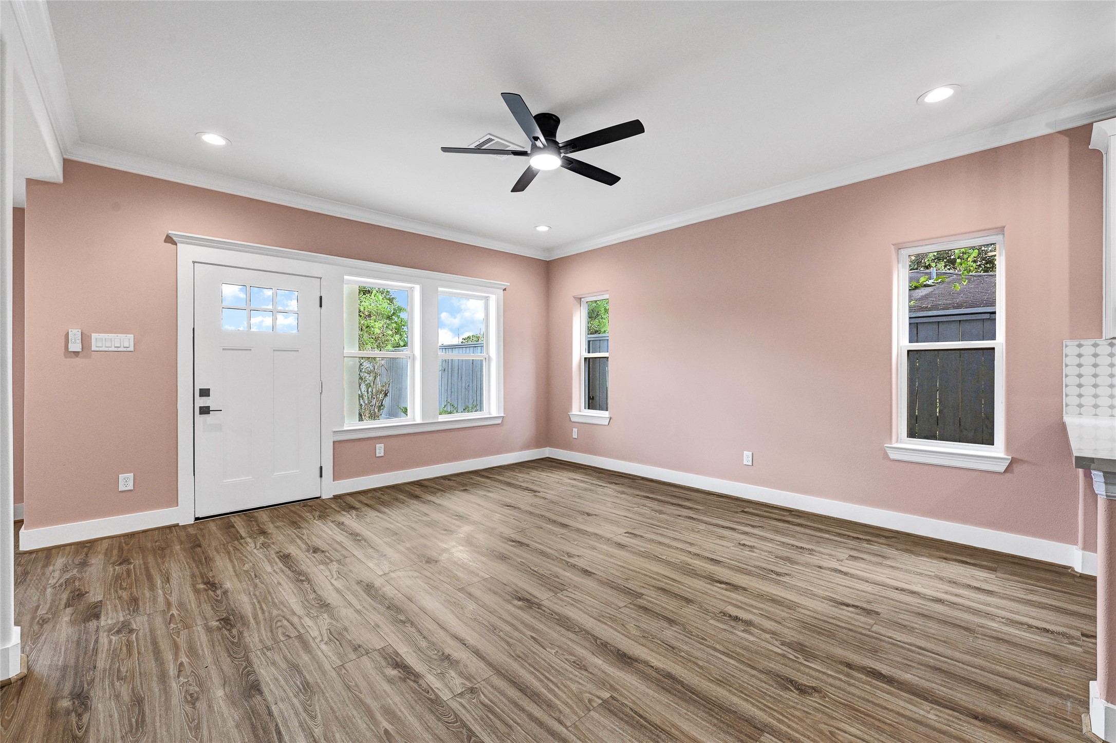 3834 Mt Pleasant Street Houston, TX 77021 - Photo 6 of 50 a view of an empty room with wooden floor and a window
