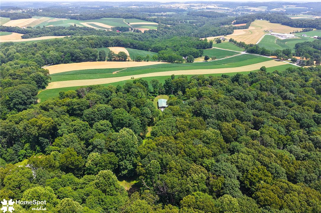 3795 Rhoades Road Kempton, PA 19529 - Photo 42 of 42 Nestled within verdant woods, a private retreat emerges amidst rolling farmland.