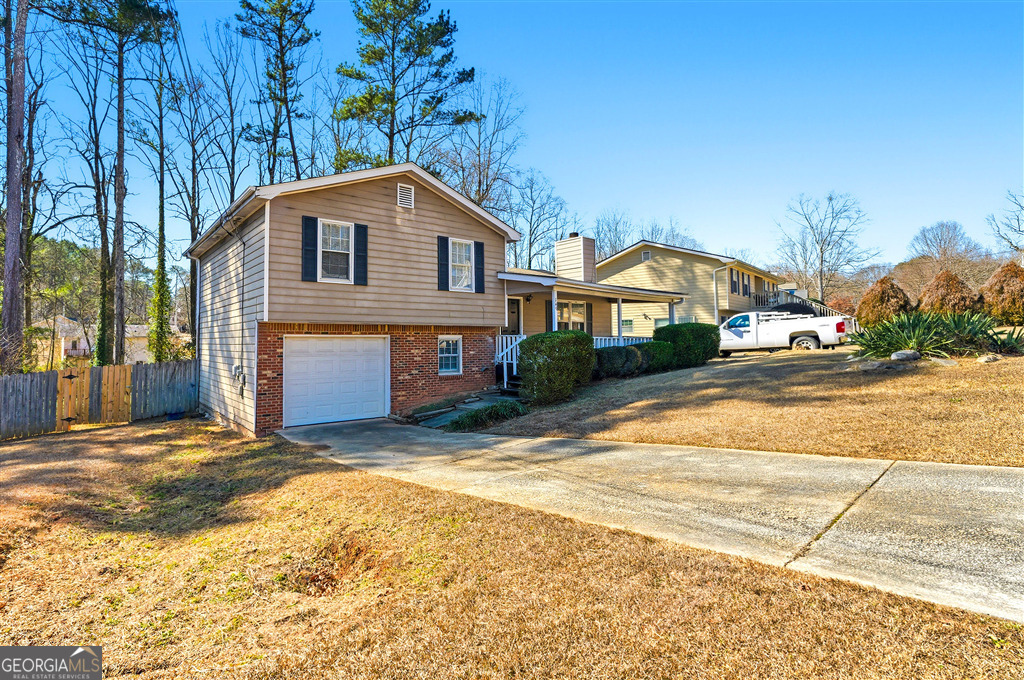 1496 Cherry Hill Road Southwest Conyers, GA 30094 - Photo 2 of 20 a view of a house with a patio
