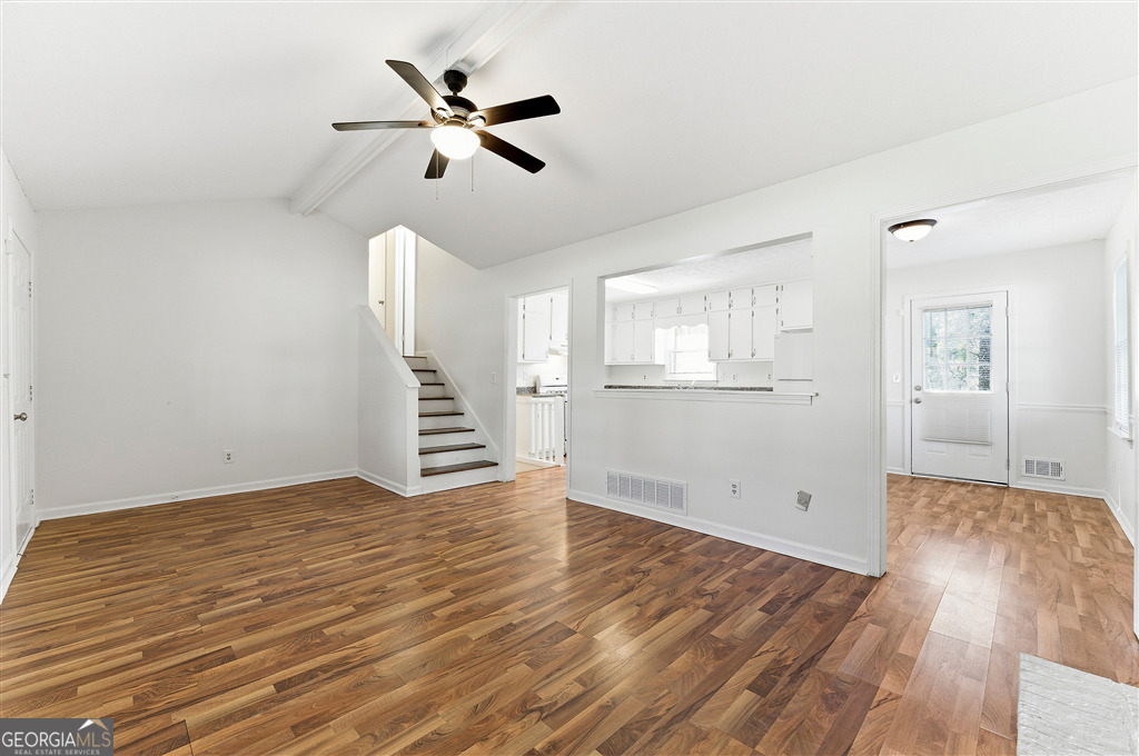 1496 Cherry Hill Road Southwest Conyers, GA 30094 - Photo 5 of 20 wooden floor in an empty room with a window