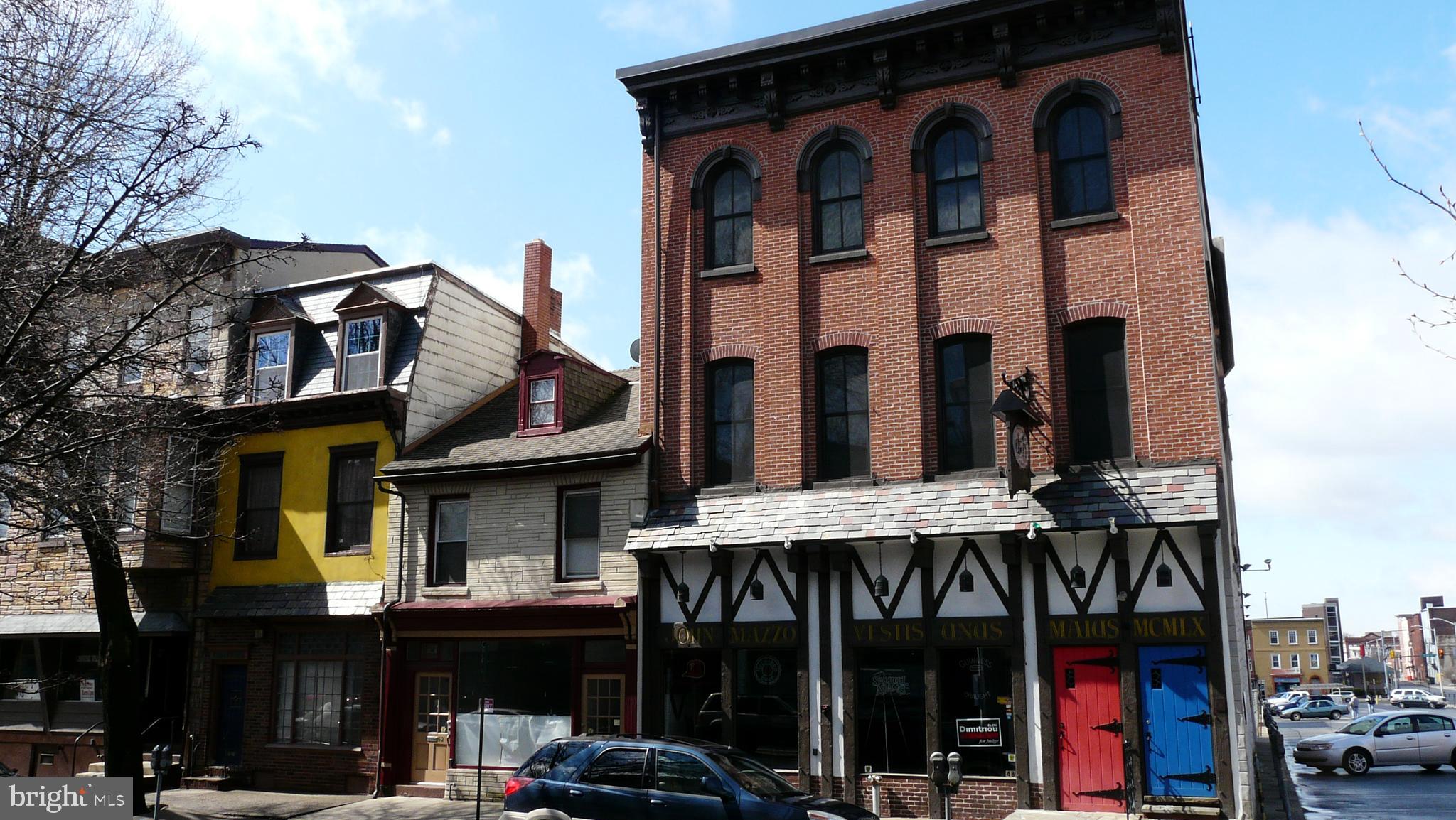 a view of a cafe with sitting area