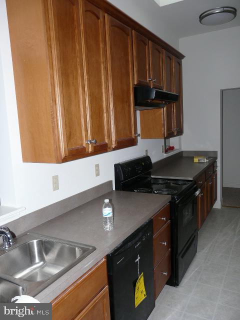 48 South 6th Street, Unit 3F Reading, PA 19602 - Photo 6 of 7 a kitchen with a sink and a stove top oven